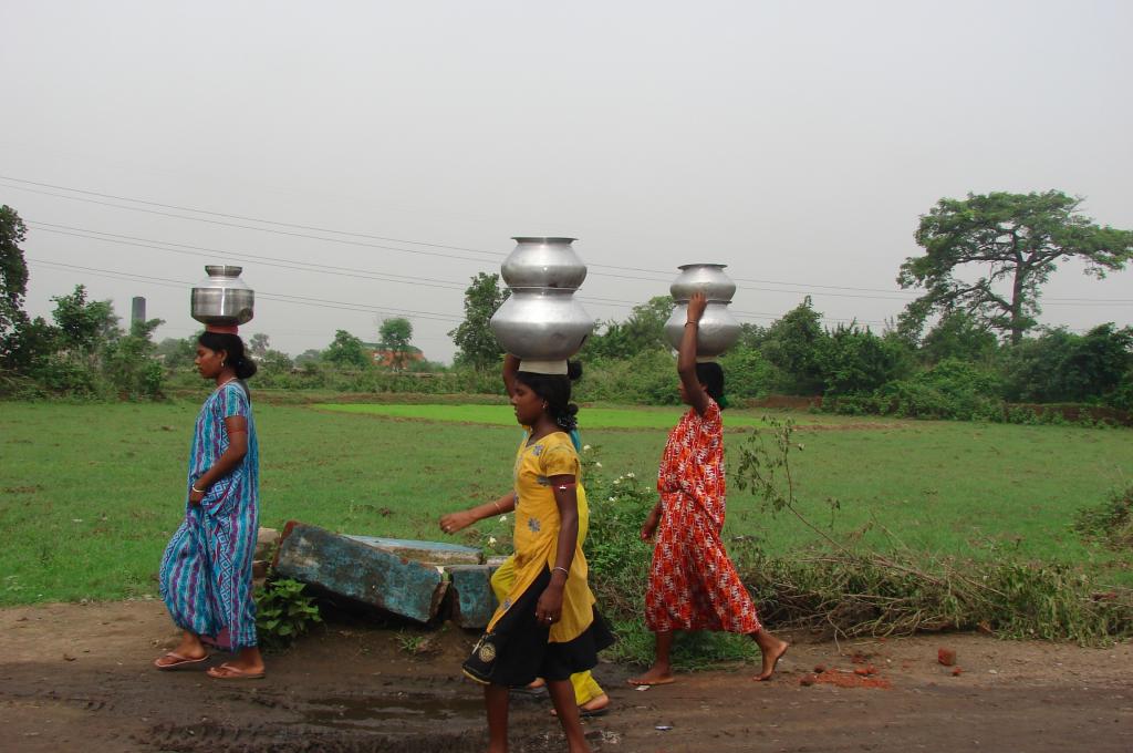 A group of ladies walking a long distance to get access to safe and clean drinking water