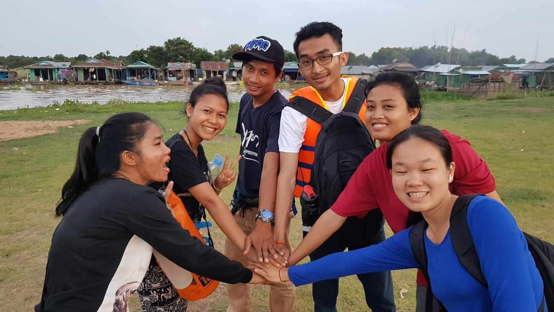A team huddle, comprising of members from Wateroam, OceaNUS, Souperstar and Paññāsāstra University of Cambodia, in Cambodia