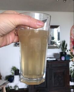A glass of untreated and contaminated water, caused by the bushfires in Australia