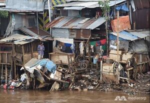 The aftermath of a flood disaster, damaging homes and infrastructures in the area