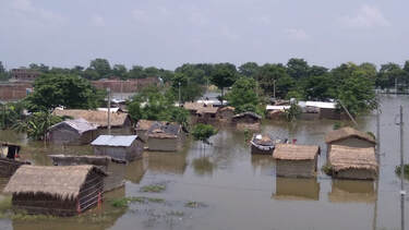 Houses submerged in contaminated water in a flood disaster zone