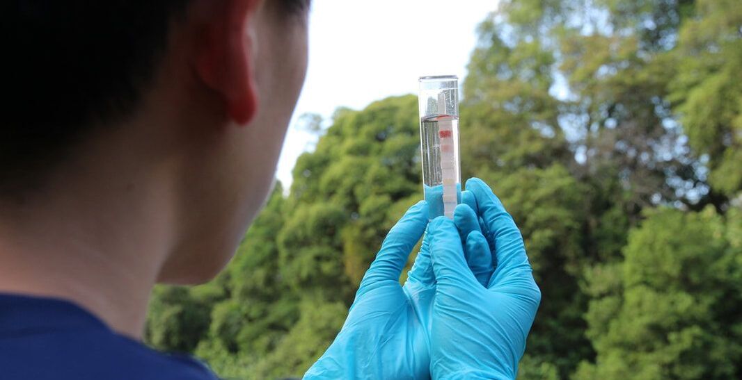 An individual testing for naturally contaminated water