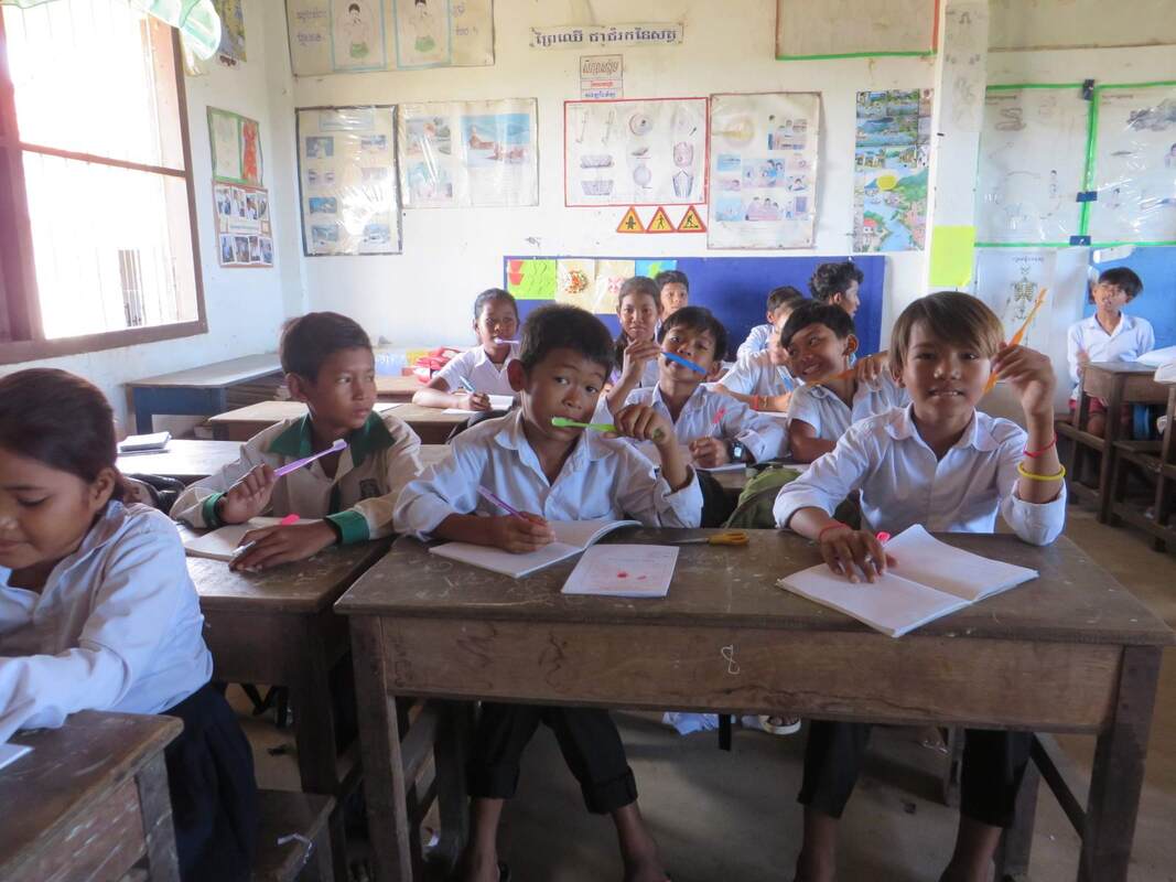 Young children in Cambodia learning about good hygiene in their classroom